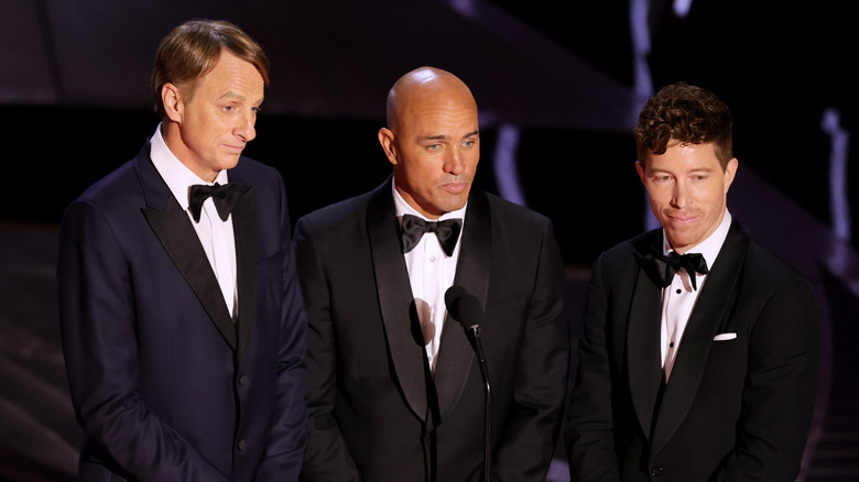 Tony Hawk, Kelly Slater, and Shaun White presenting James Bond