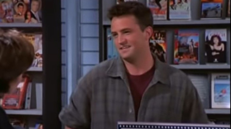 Chandler smiles in video store