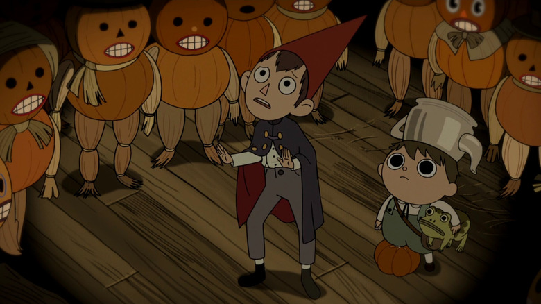 Wirt and Gregory standing with pumpkin people