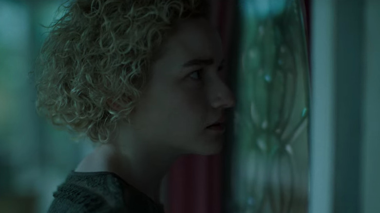 Julia Garner Ruth Langmore outside door