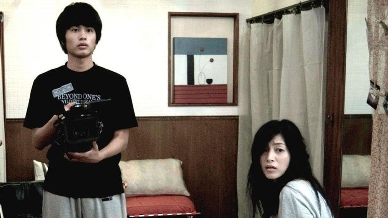 Haruka Yamano (Kazuyoshi Tsumura) and Koichi (Aoi Nakamura) in Paranormal Activity 2: Tokyo Night