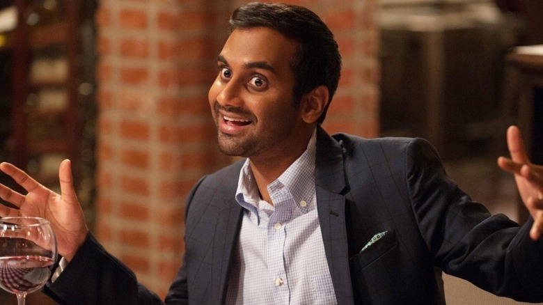 Aziz Ansari Tom Haverford smiling wine glass