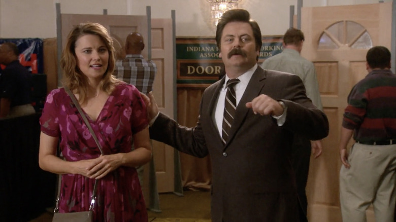 Ron touching Diane's shoulder