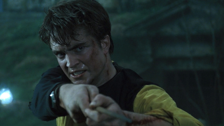 Cedric Diggory holding up his wand