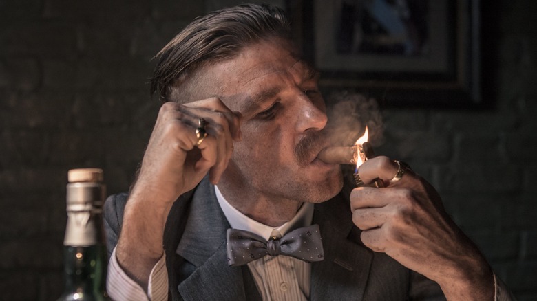 Arthur Shelby smoking a cigar 