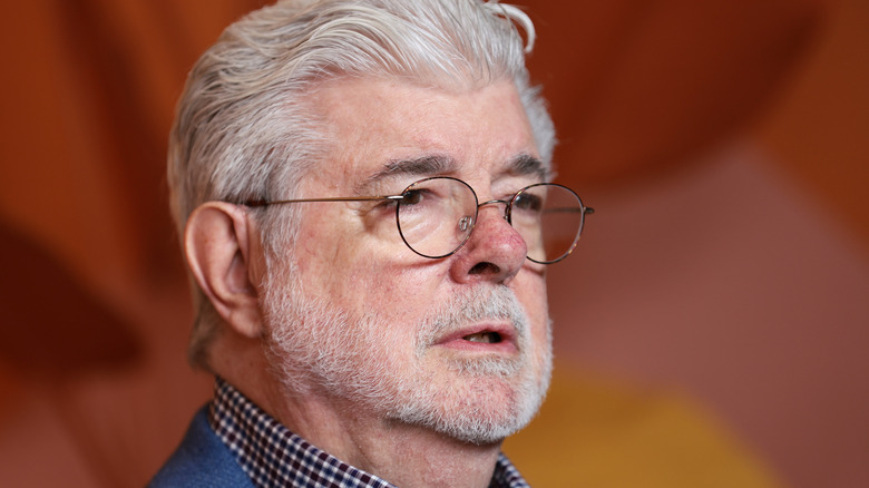 George Lucas wearing glasses and collared shirt