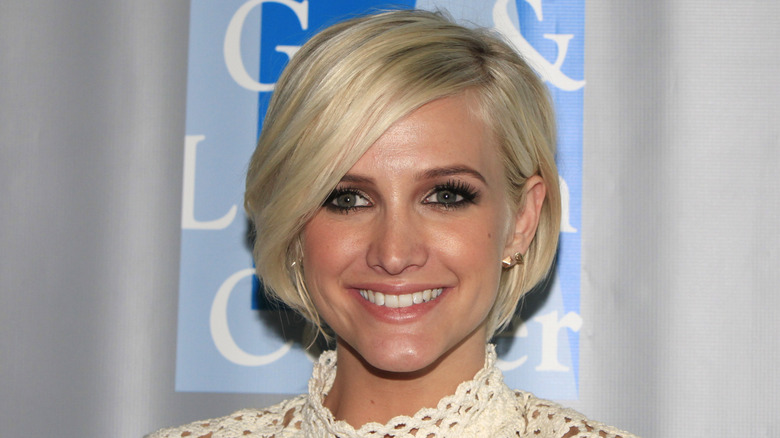 Ashlee Simpson smiling at event