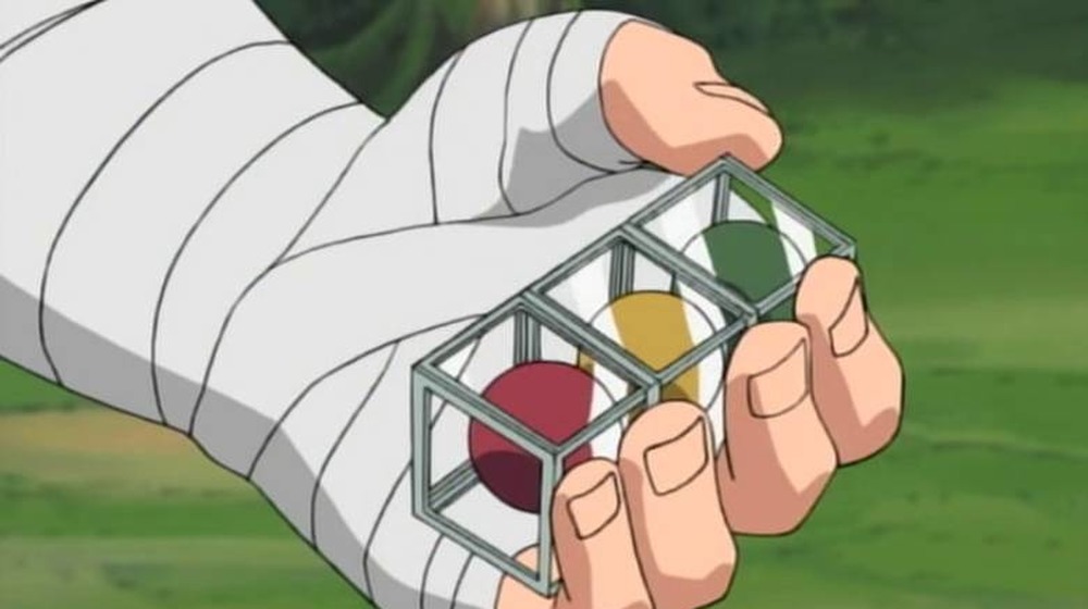 Chōji holding three colored pills