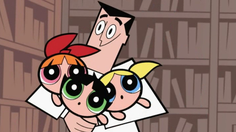 Professor Utonium holding the Powerpuff Girls