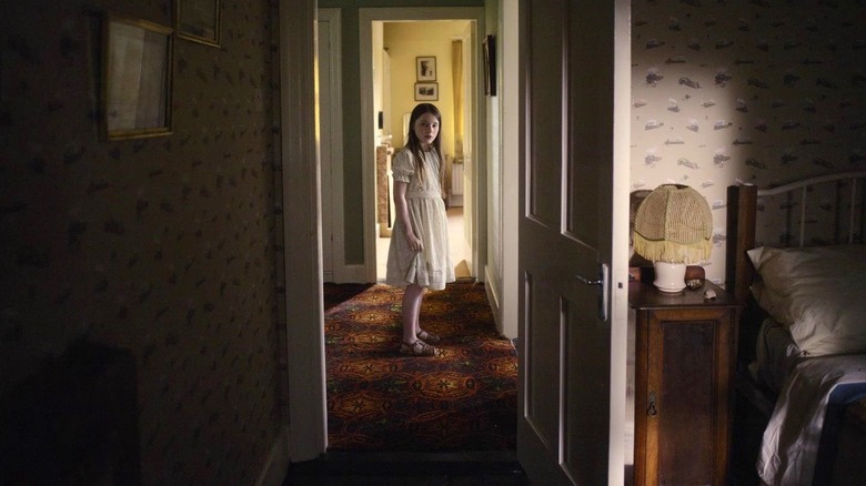 Cáit looks into a bedroom in "The Quiet Girl" (2023)