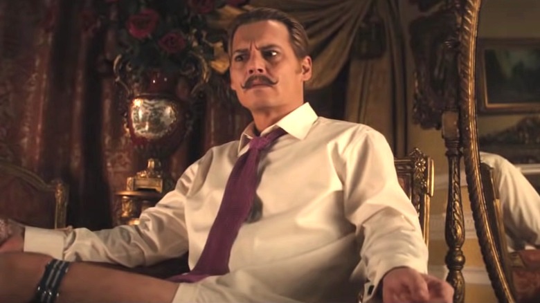 Mortdecai wearing a tie