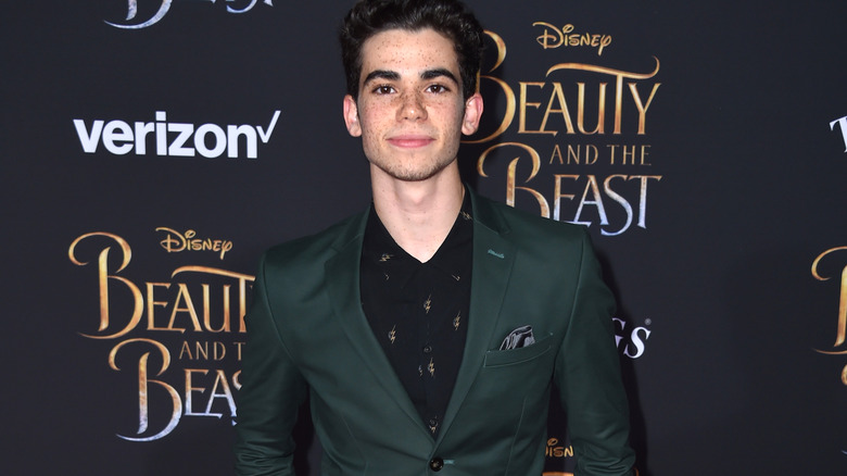 Cameron Boyce wearing a green blazer