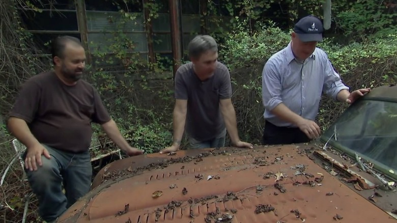 Mike and Frank looking at cars