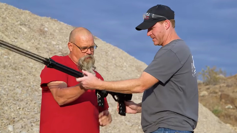 Rick and Alex Cranmer holding speargun