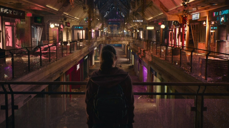 Ellie looks out at abandoned mall