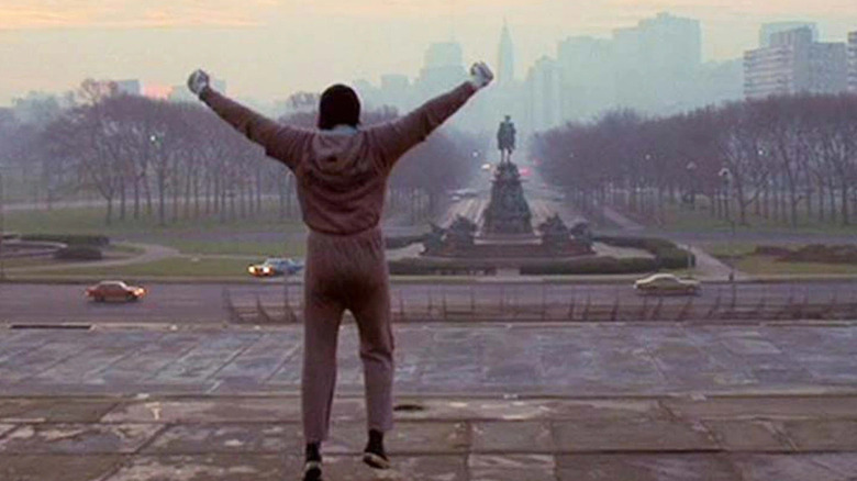 Sylvester Stallone in Rocky on top of steps