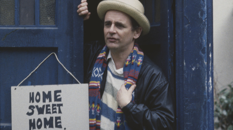 Seventh Doctor in TARDIS doorway