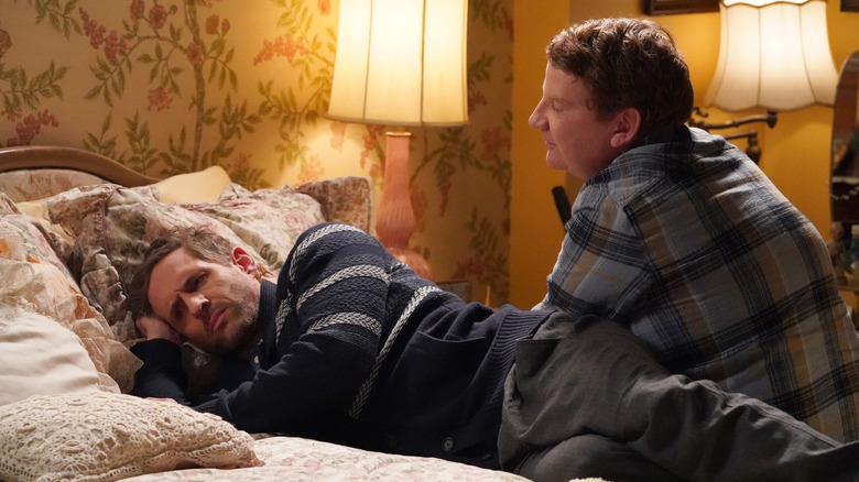 Jack laying on a bed pouting while Dale comforts him in "A.P. Bio"