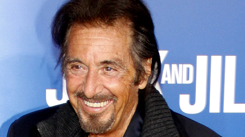 Al Pacino smiling for press