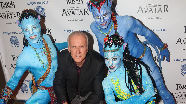 James Cameron surrounded by Na'vi