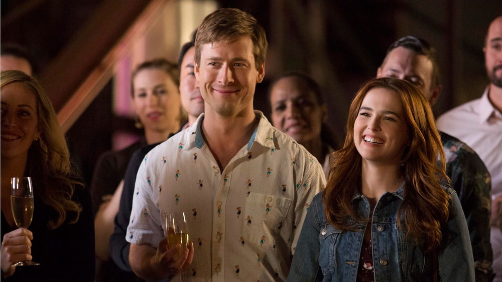 Zoey Deutch and Glen Powell smiling