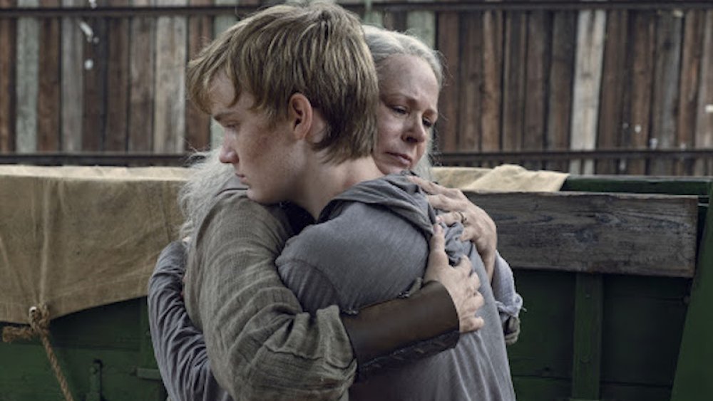 Carol hugs her adopted son Henry on The Walking Dead