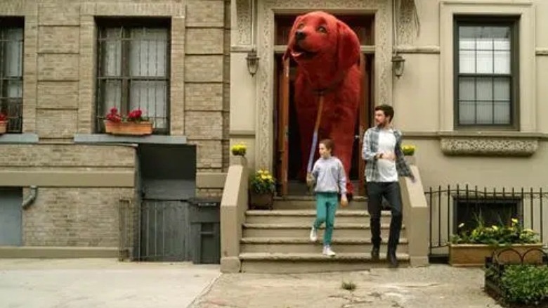 Clifford the big red dog walking out of apartment