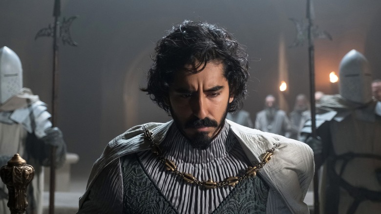 Dev Patel bending the knee