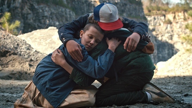 Eleven hugging Mike and Dustin