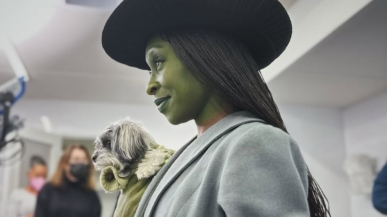 Cynthia Erivo in a makeup trailer holding her dog