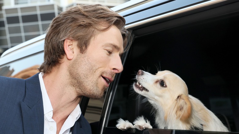 Powell posing with dog