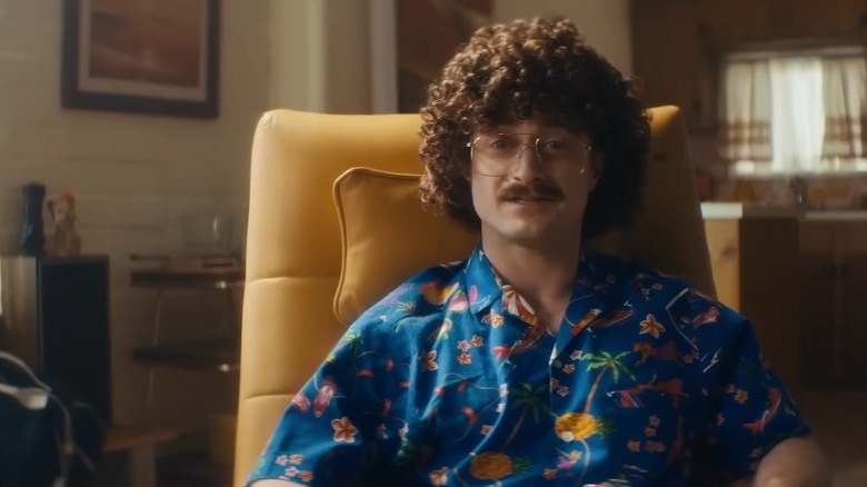 Weird Al Yankovic sitting in armchair