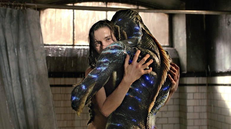 Elisa and Amphibian Man hugging