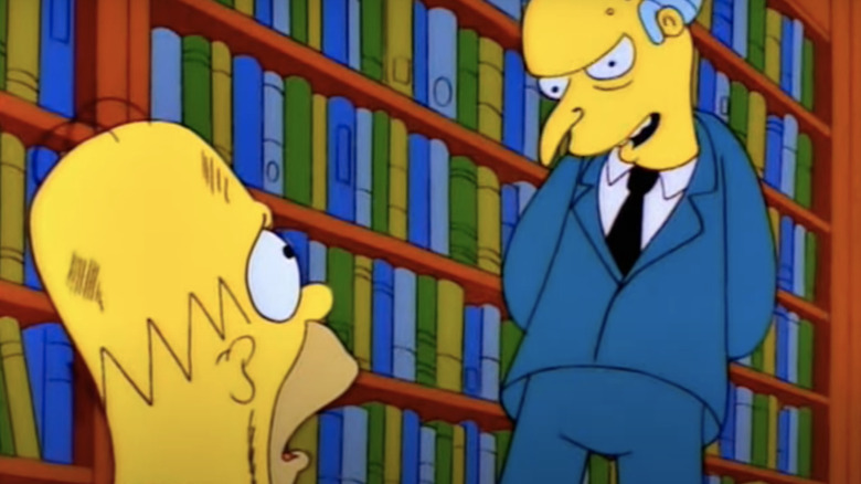 Homer Simpson staring up at Mr. Burns