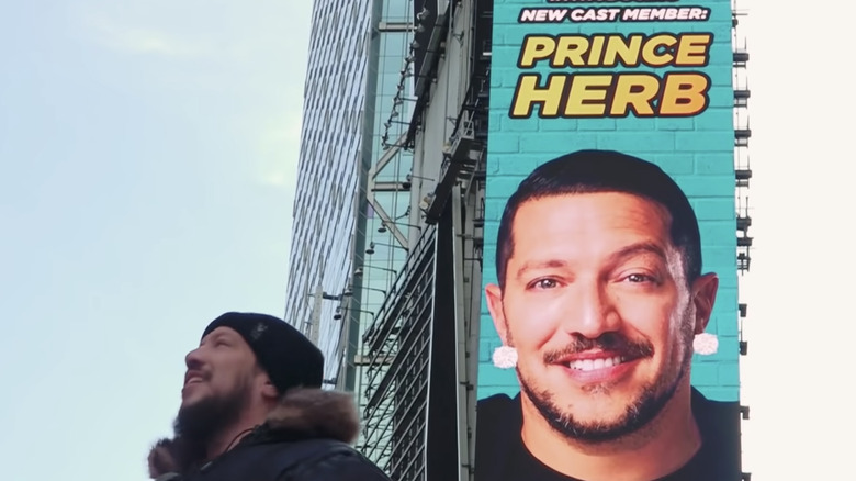 Sal behind the poster for Prince Herb