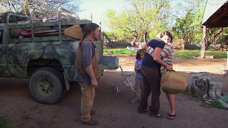 Jason and his family embrace