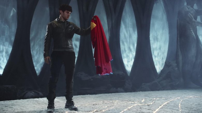 Seg holding Superman's cape