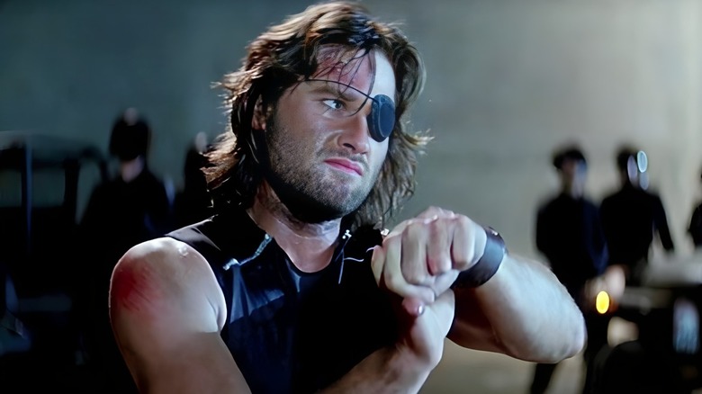 Snake Plissken handcuffed