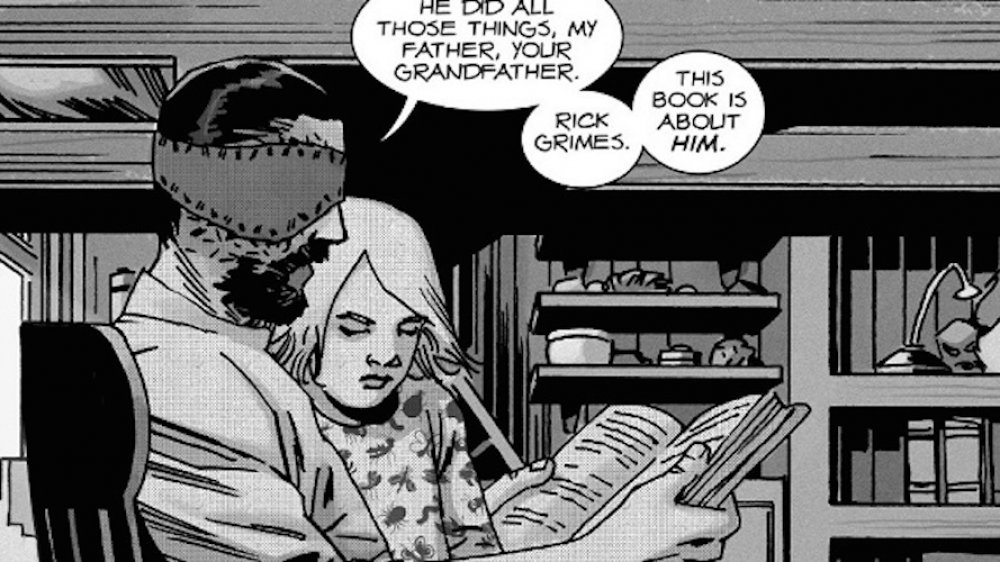 Carl reads to his daughter in The Walking Dead