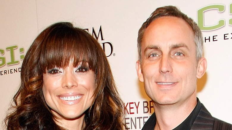 Liz Vassey and Wallace Langham smiling together