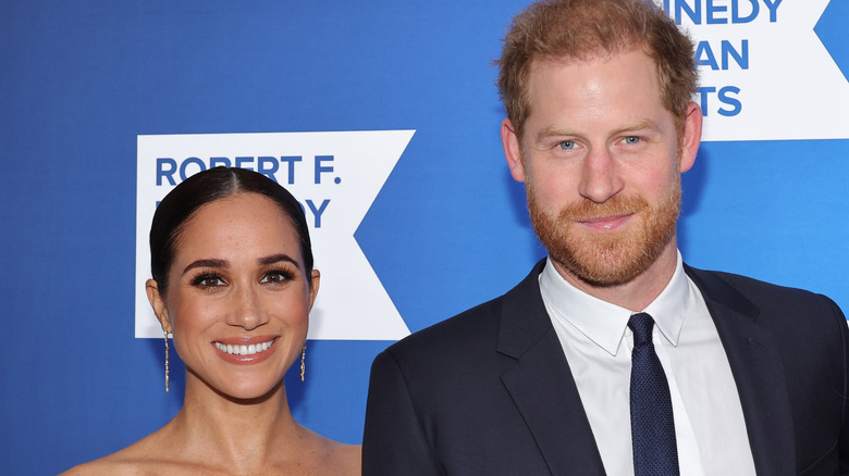 Prince Harry and Meghan Markle smile