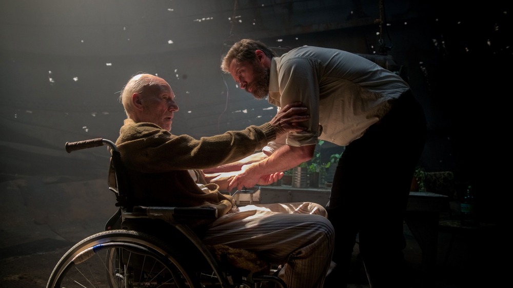 Hugh Jackman approaches a wheelchair-bound Patrick Stewart