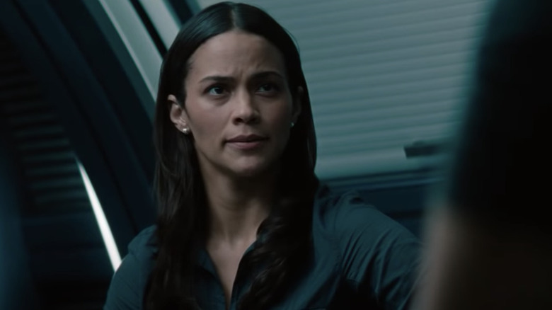 Paula Patton in train compartment