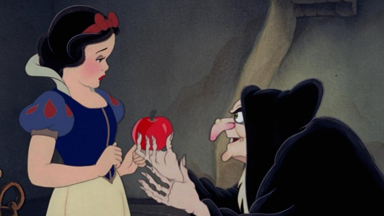 The witch offering Snow White an apple