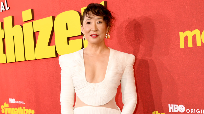 Sandra Oh wearing white dress