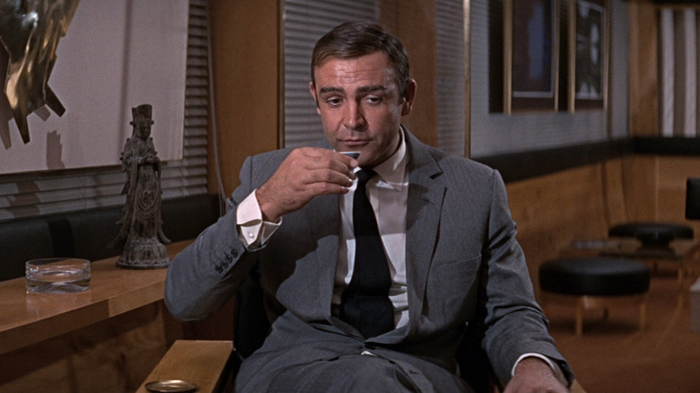 Sean Connery as James Bond drinking