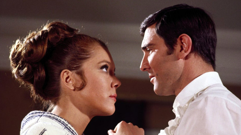 George Lazenby and Diana Rigg talking