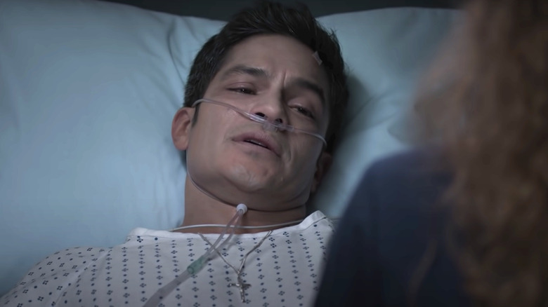 Neil Melendez lying in hospital bed