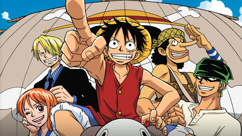 Luffy points forward with crew