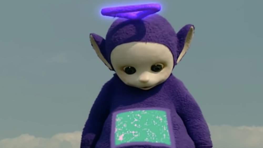 Tinky Winky looking at belly in Teletubbies